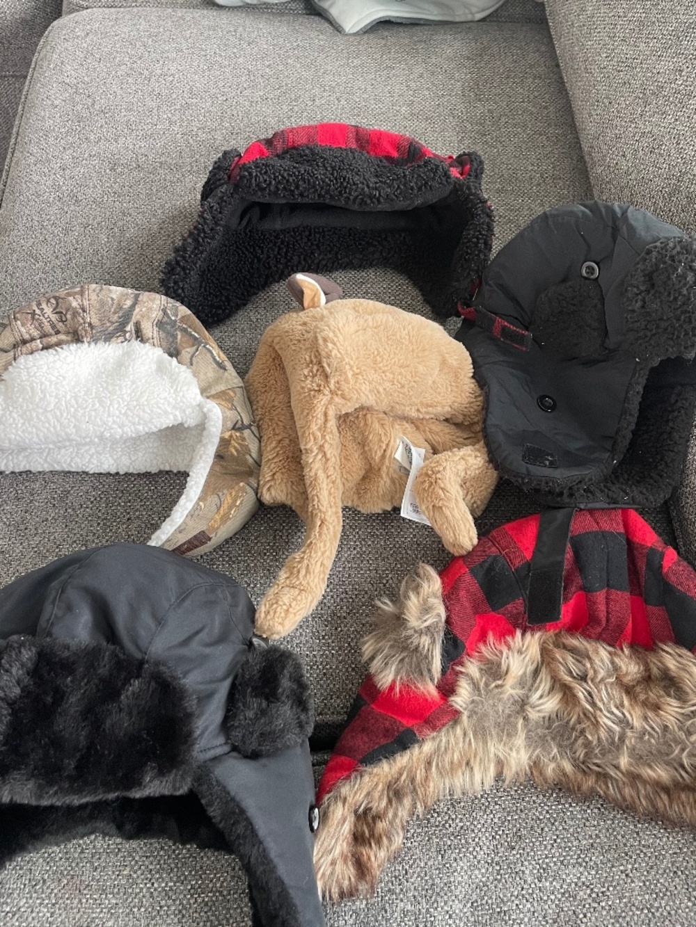 Lots of kids trapper hats